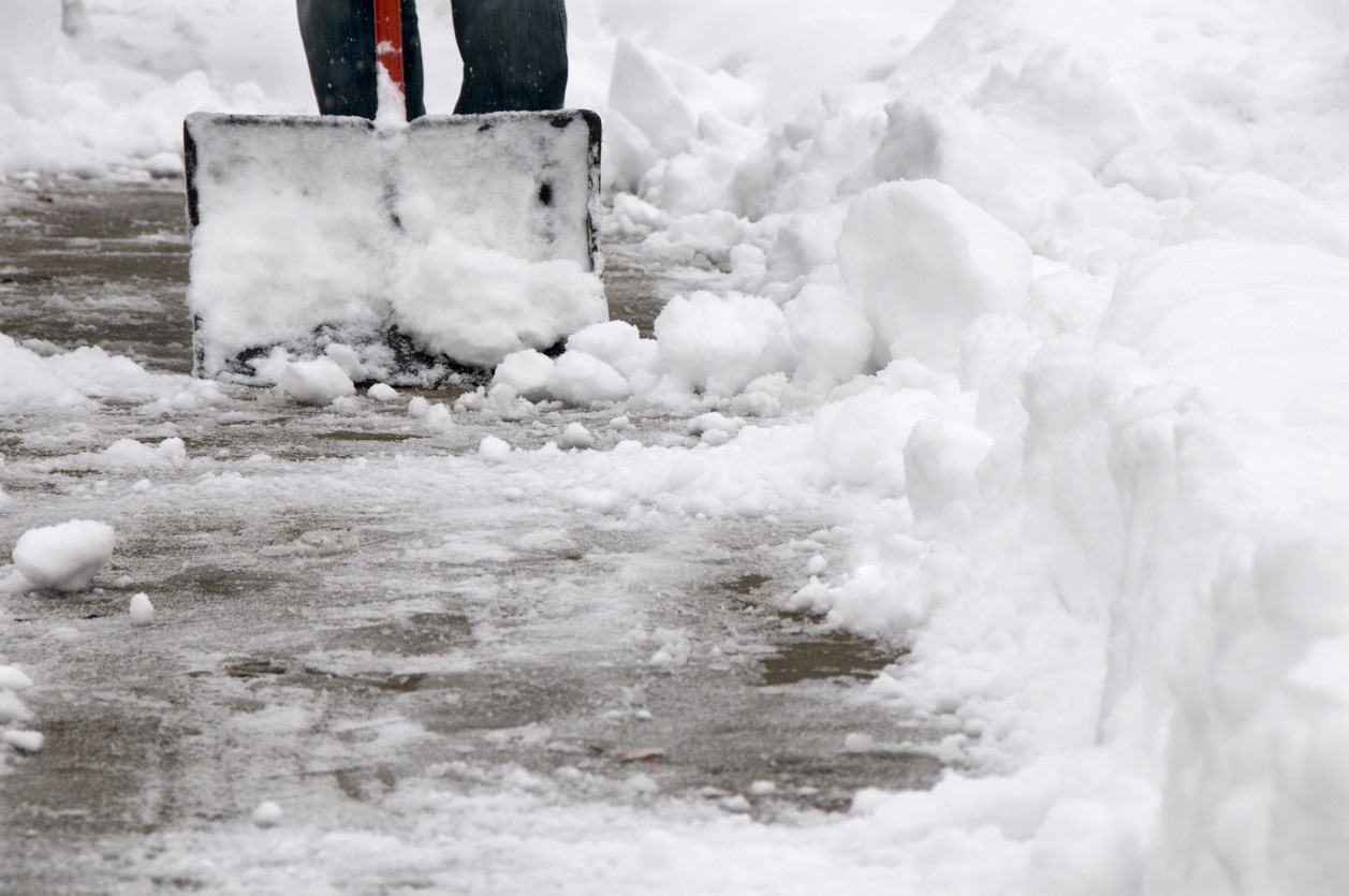 Shoveling Snow from Sidewalk