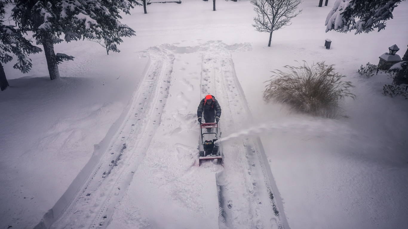 Navigating the Challenges: Clearing Snow from Steep Driveways Safely and Effectively